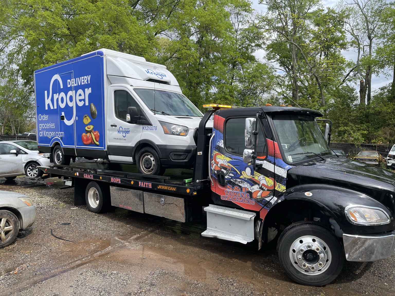 S&P Towing transporting a commercial delivery van