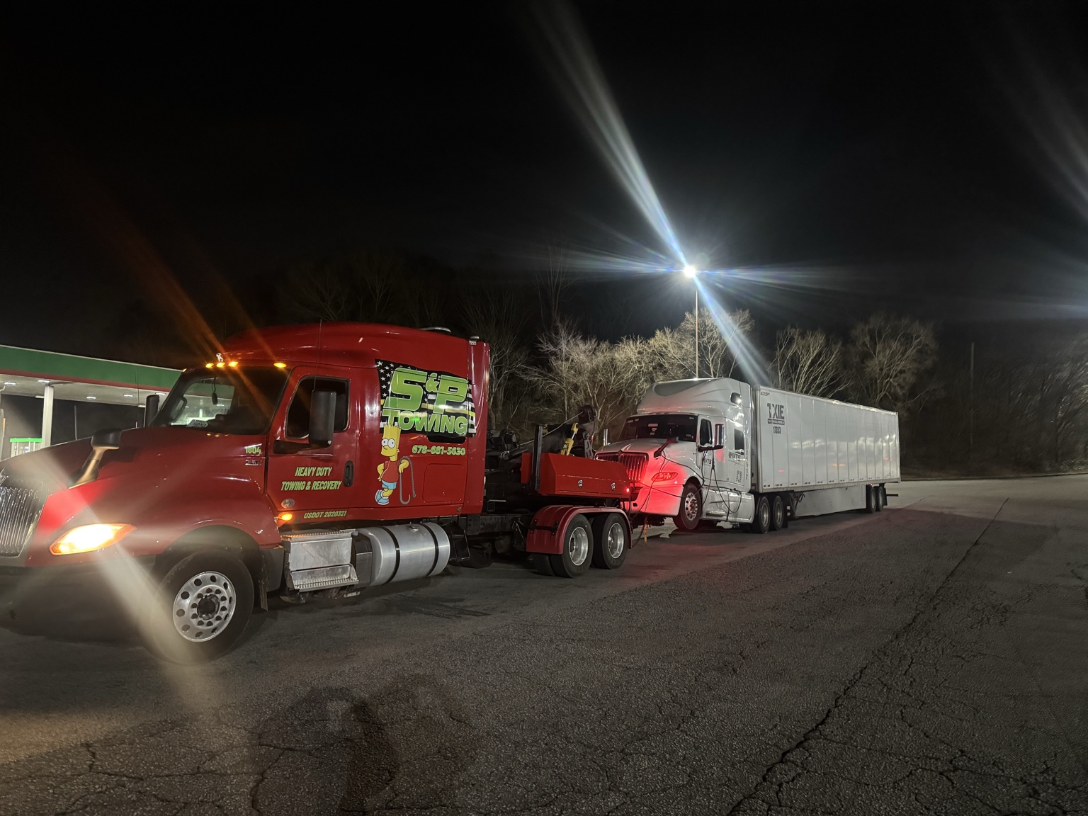 S&P Towing recovering a tractor-trailer at night